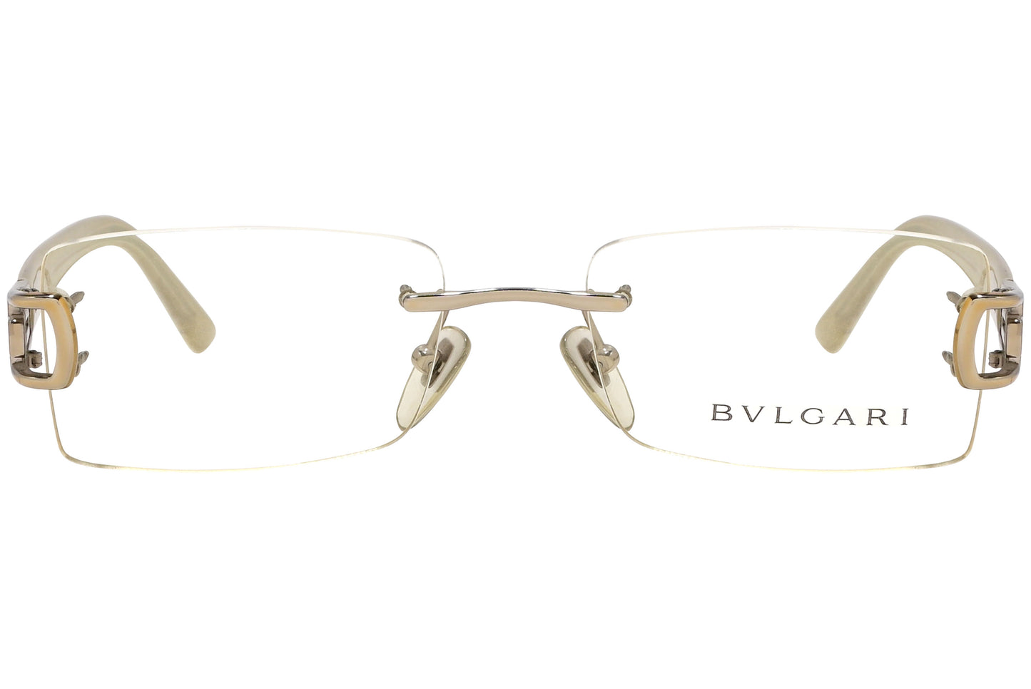 A pair of rimless eyeglasses with gold and white frames.