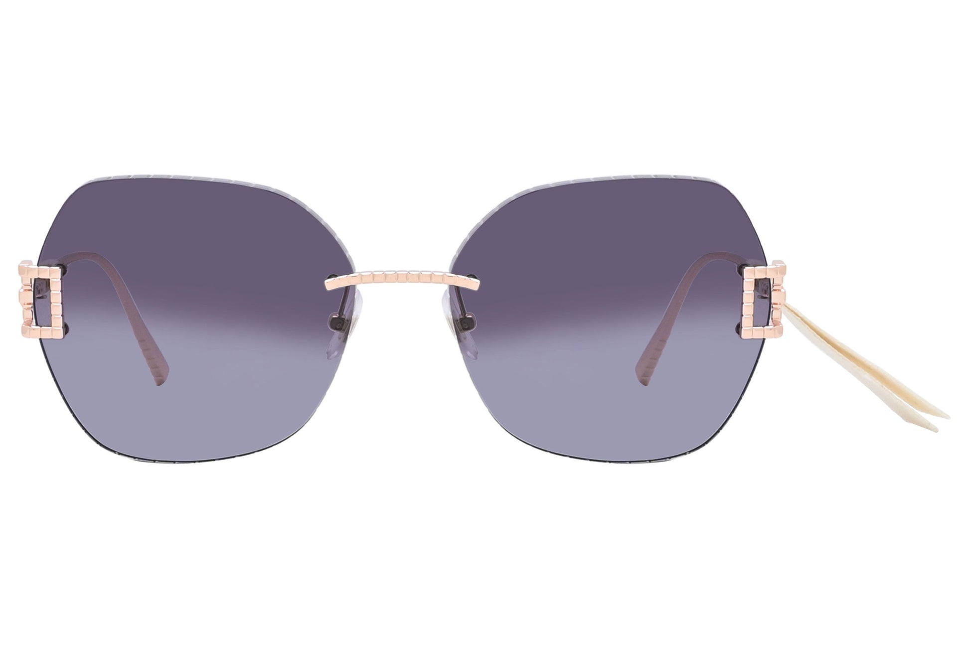 Sunglasses with gradient lenses and rose gold frames on a white background