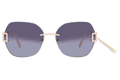 Sunglasses with gradient lenses and rose gold frames on a white background