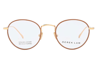 Gold-framed eyeglasses with 'Derek Lam' branding on a white background