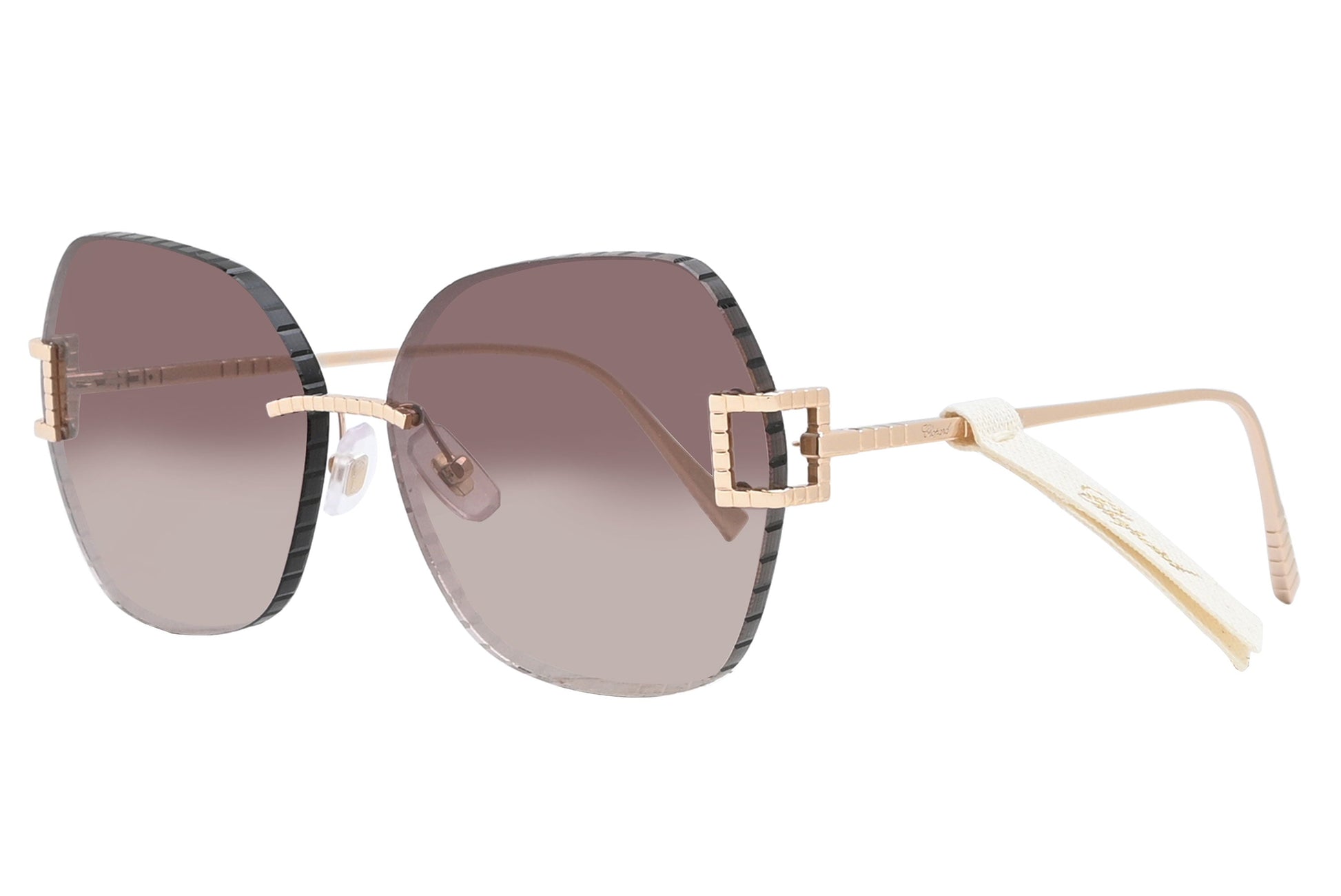 Sunglasses with gold frame and gradient lenses on a white background