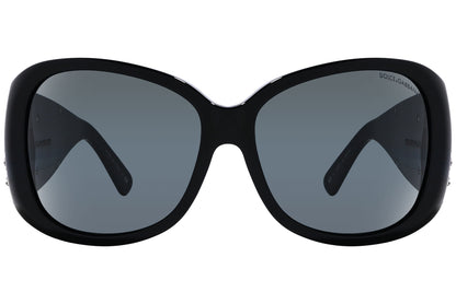 Close-up of Dolce & Gabbana oval sunglasses in green highlighting frame texture and logo detail

