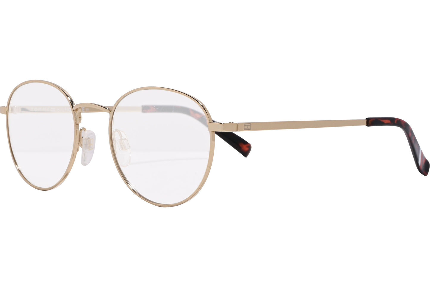 tommy hilfiger oval gold eyeglasses frame viewed from a 45-degree angle.